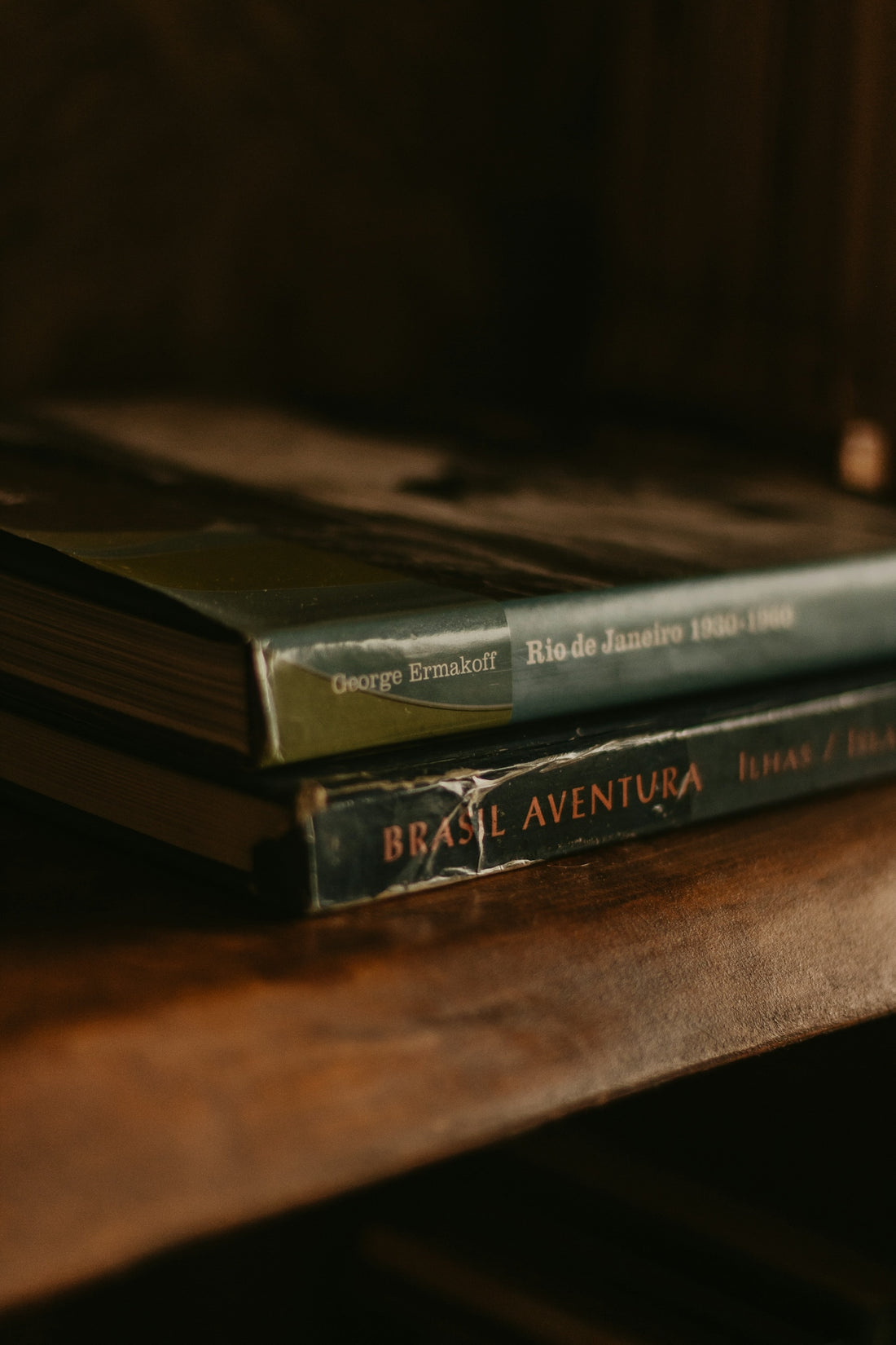 a couple of books sitting on top of a wooden table