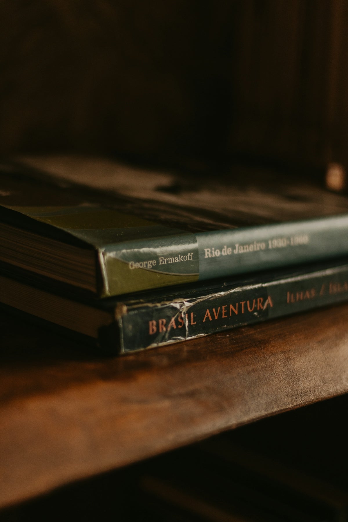 a couple of books sitting on top of a wooden table