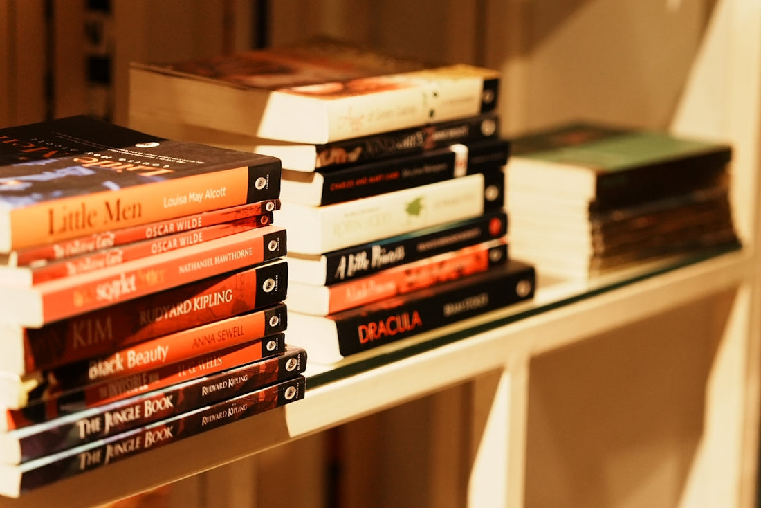 A stack of books sitting on top of a shelf