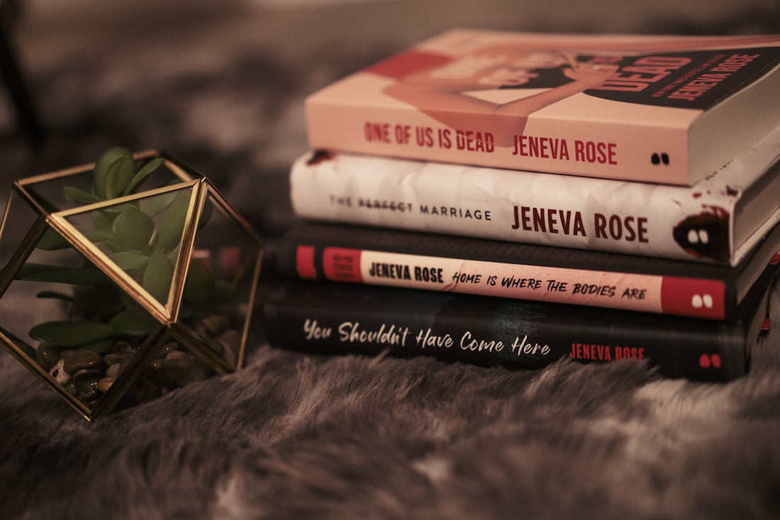 A stack of books sitting on top of a fur covered floor
