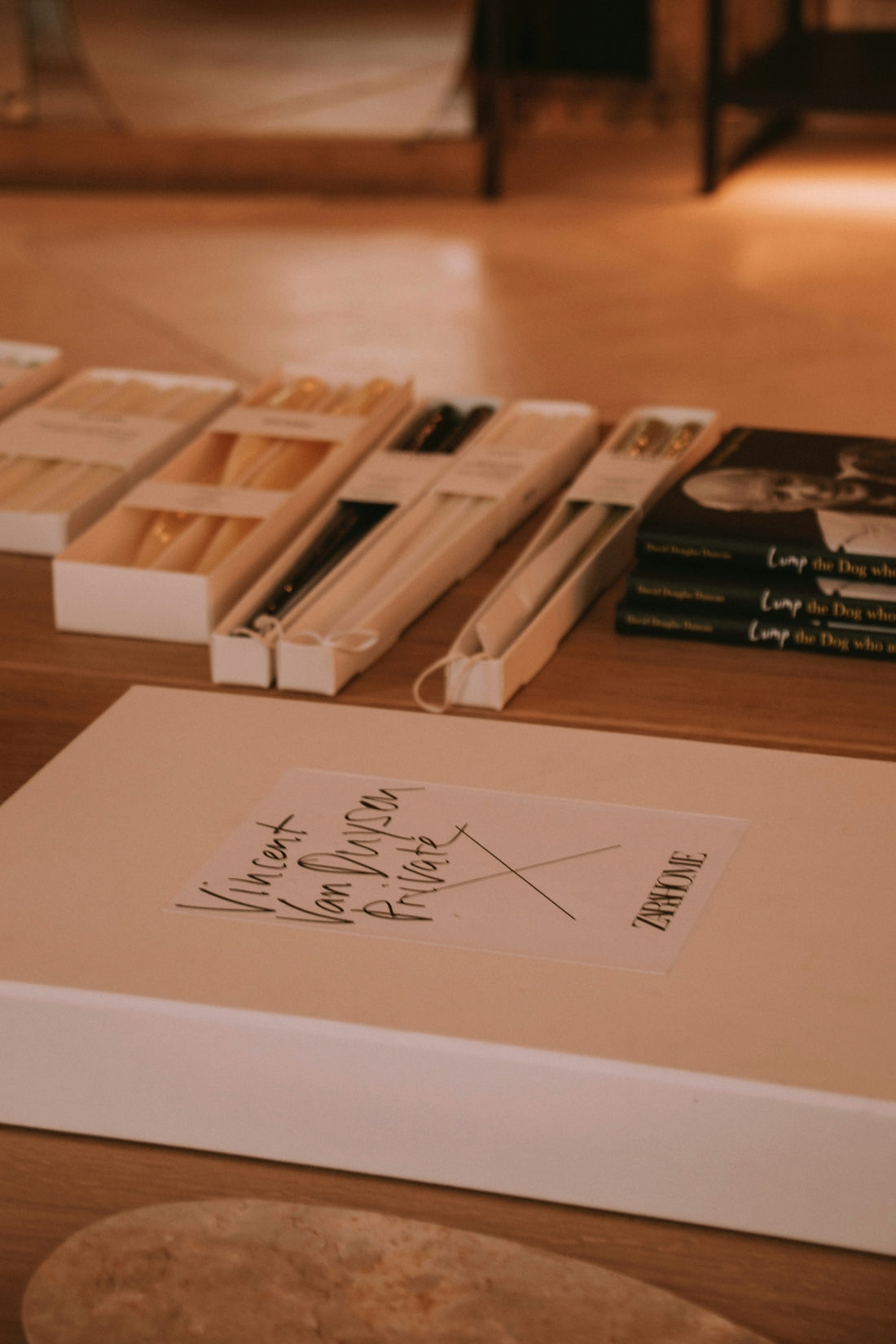 Boxes of objects are displayed on a table.